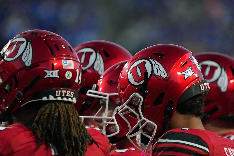 AP Photo/George Frey
University of Utah football players huddle during the Utes' Big 12 road game against in-state rival BYU on Oct. 18 in Provo. The Utes announced Tuesday they have entered into a partnership with a private equity firm to help generate new revenue streams for the school's athletic department.