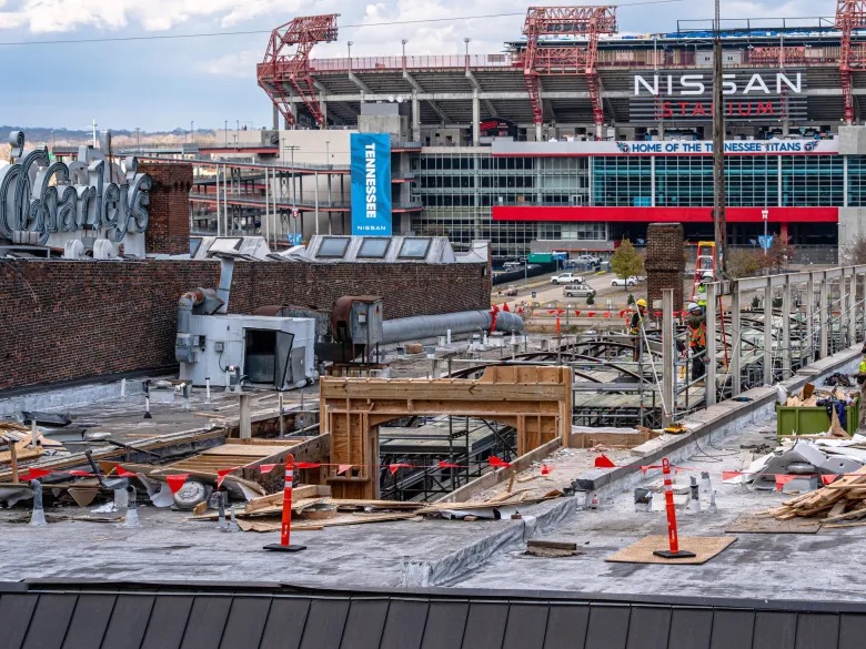 Construction is seen on a rooftop on Second Avenue overlooking Nissan Stadium in Nashville. (Martin B. Cherry/Nashville Banner)
