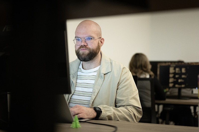 Staff photo: Seth Carpenter/Valerie Health Operations Coordinator Josh Osterhaus works out of the Valerie Health office space in Chattanooga.