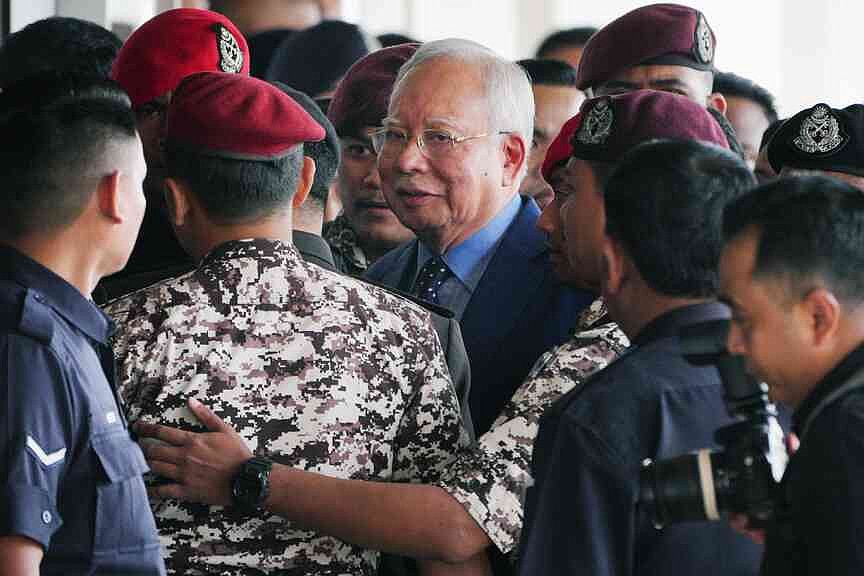 Former Malaysian leader sentenced to 15 years in corruption trial