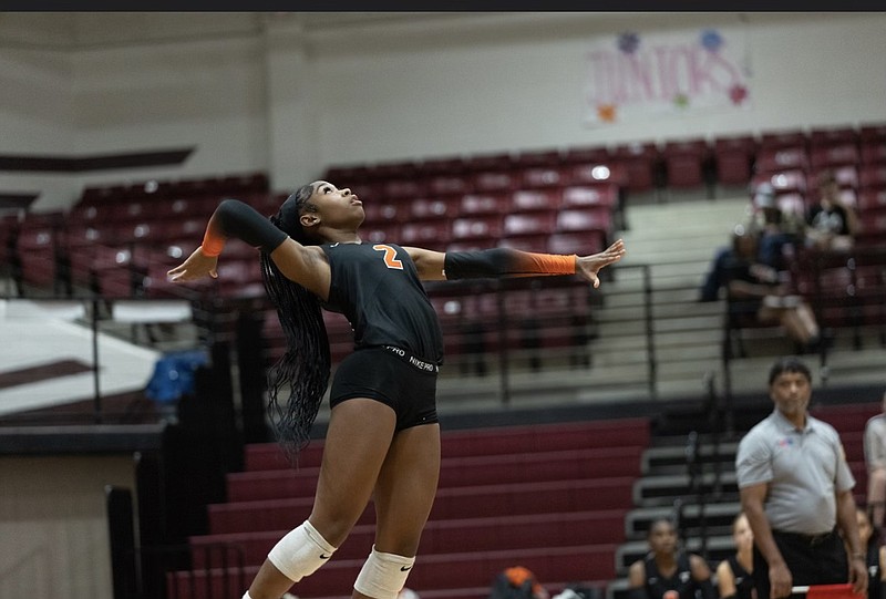 This file photo shows Texas High's Kyleigh Perkins serving. (Submitted photo)