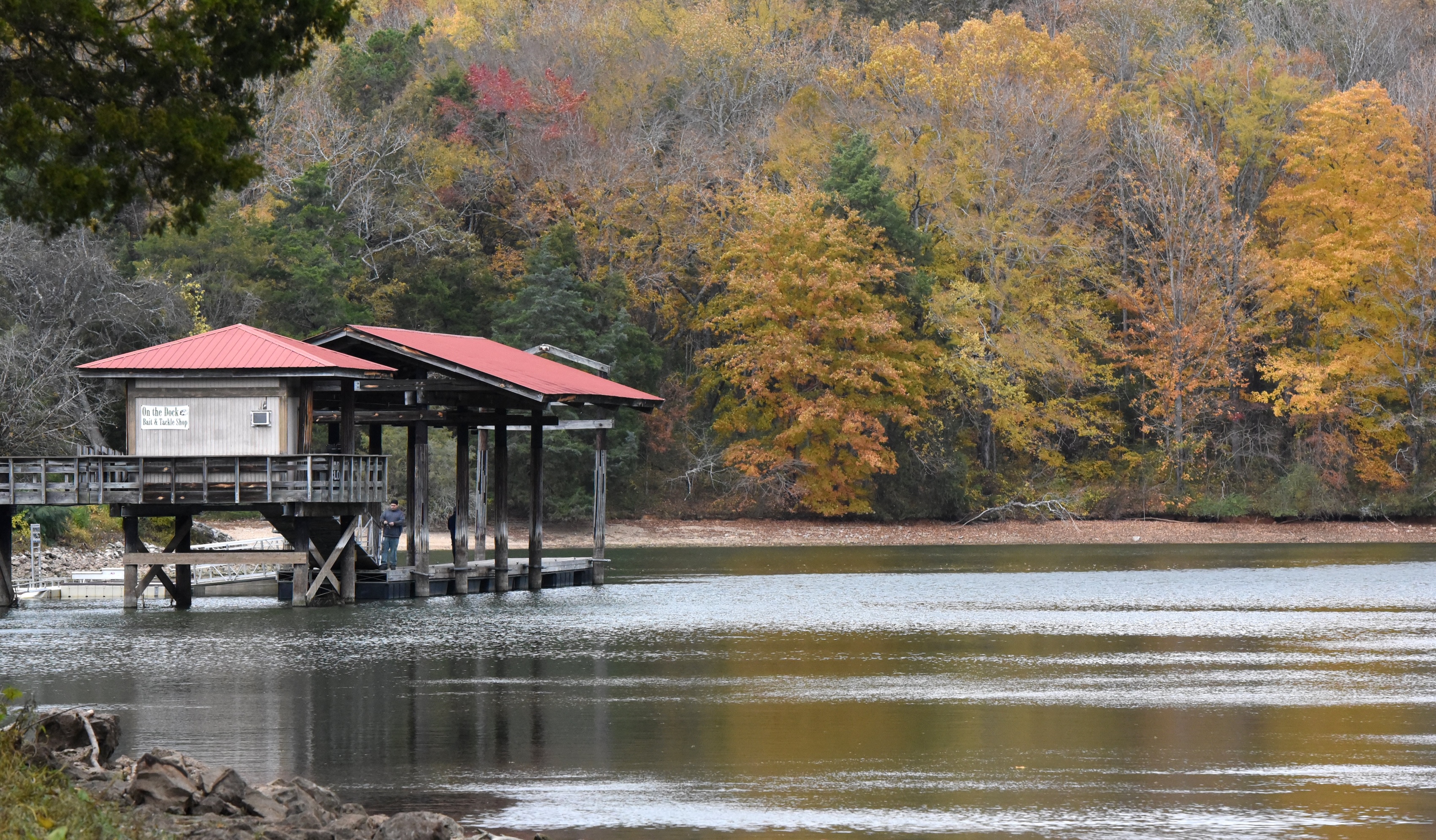 Staff file photo by Matt Hamilton / Leaves change color as people fish from a dock at Booker T. Washington State Park. A public input meeting on proposals for the park is set for Jan. 13, 2026, in the park assembly hall.