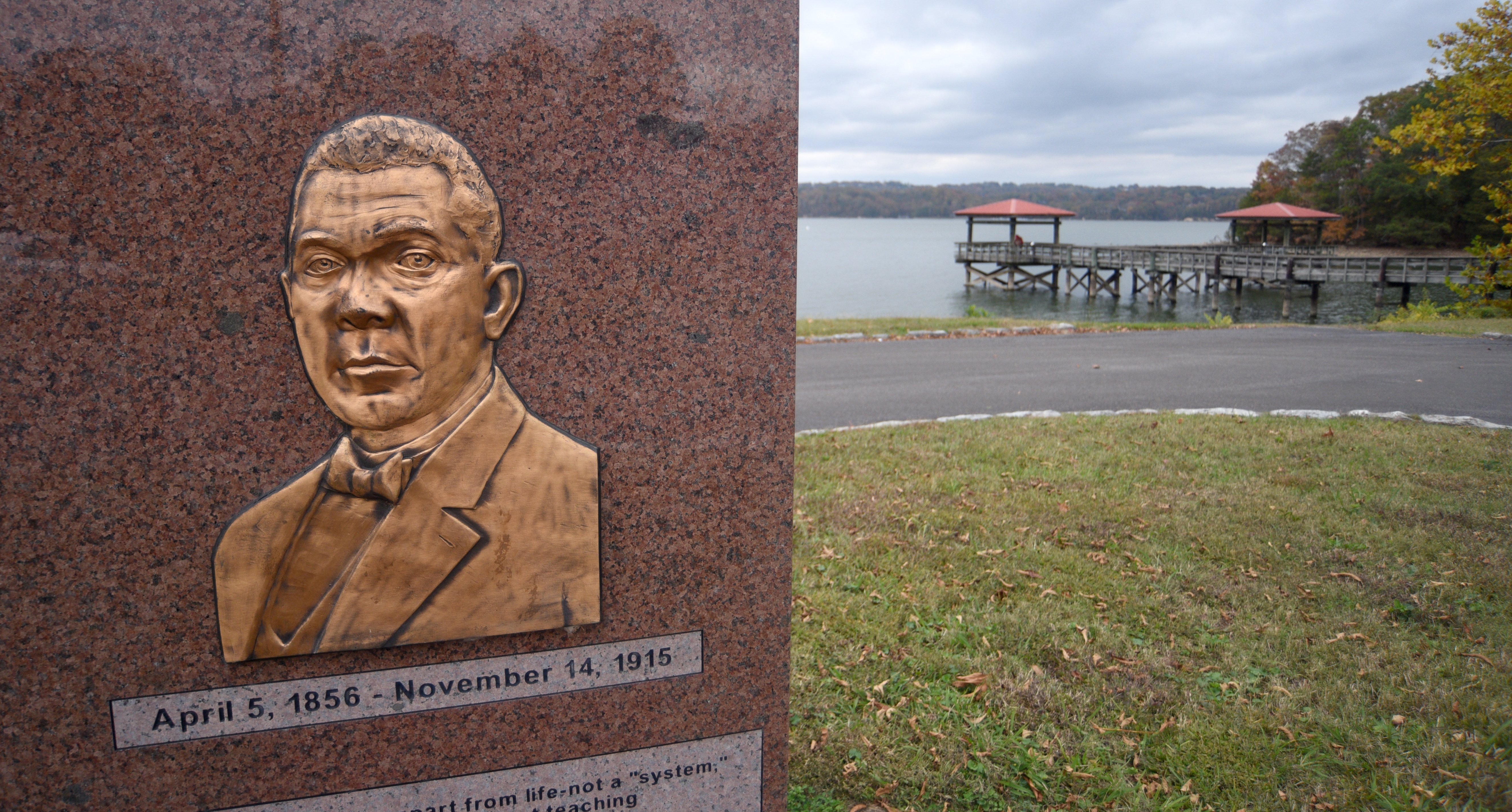 Staff file photo by Matt Hamilton / A plaque with an image of Booker T. Washington stands near the water at Booker T. Washington State Park. A public input meeting on proposals for the park is set for Jan. 13, 2026, in the park assembly hall.