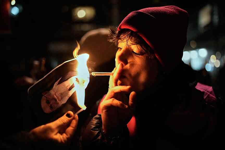 cigarette at night Man Smoking a  Free Stock Photo Cigarette litter at night on