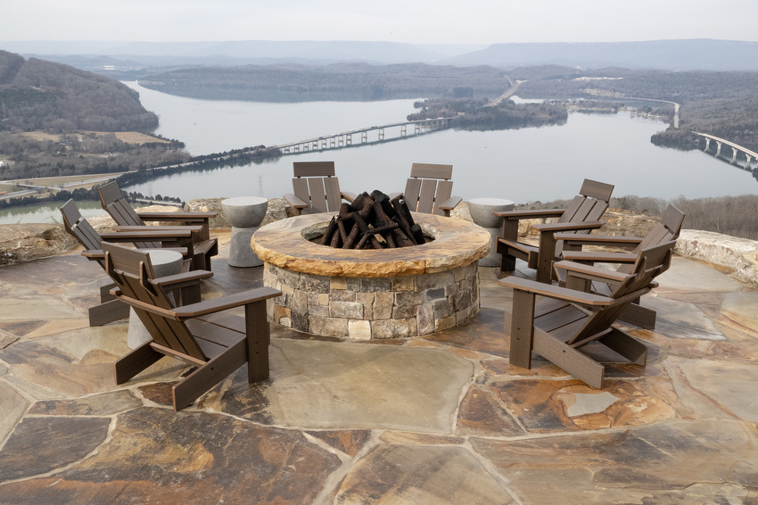 Staff Photo by Seth Carpenter / The Tennessee River is seen just beyond a fire pit at Riverdance, a restaurant just beyond the gates of the River Gorge Ranch community in Marion County.