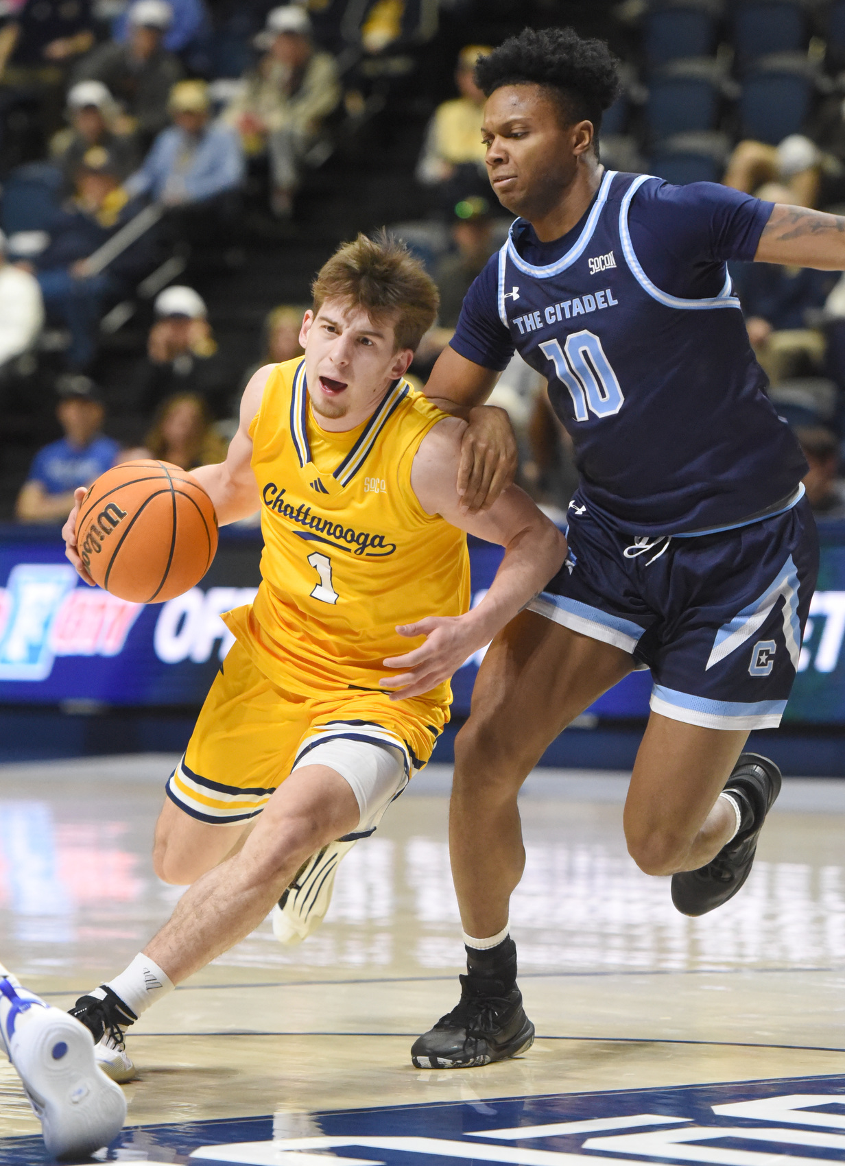 Staff photo by Matt Hamilton/ Citadel (10) Braxton Williams defends as UTC (1) Brennan Watkins dribbles the ball during their game at McKenzie Arena on Saturday, Feb. 7, 2026.