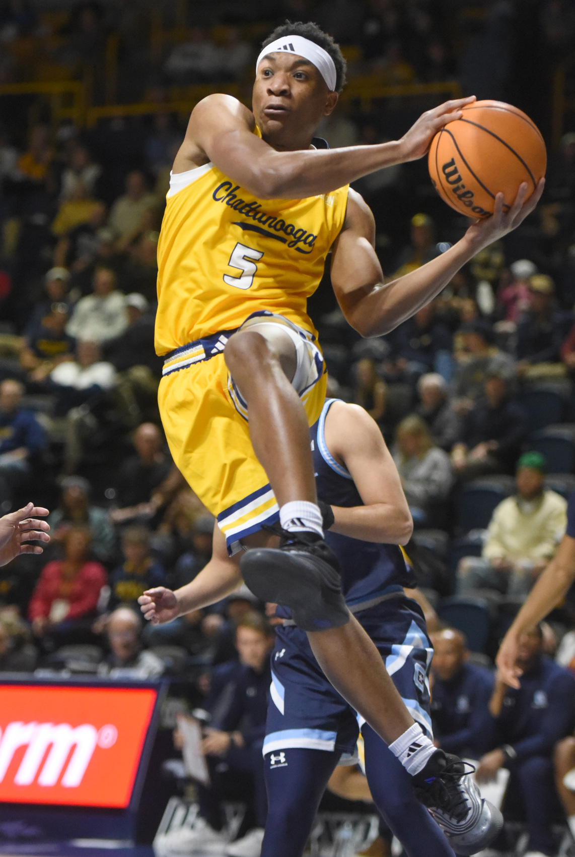 Staff photo by Matt Hamilton/ UTC (5) Jordan Frison passes the ball from under the hoop during their game against The Citadel at McKenzie Arena on Saturday, Feb. 7, 2026.