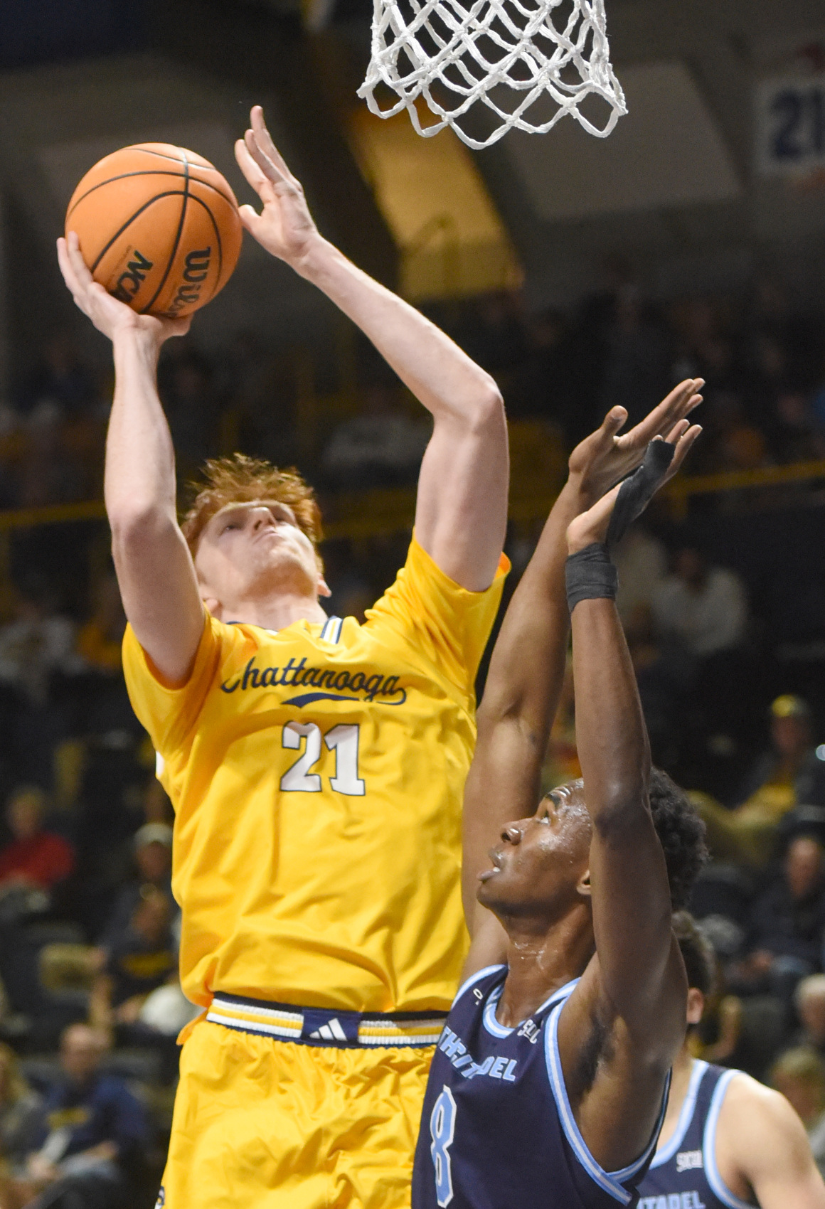 Staff photo by Matt Hamilton/ Citadel (8) Sola Adebisi defends as UTC (21) Collin Mulholland puts up a shot during their game at McKenzie Arena on Saturday, Feb. 7, 2026.