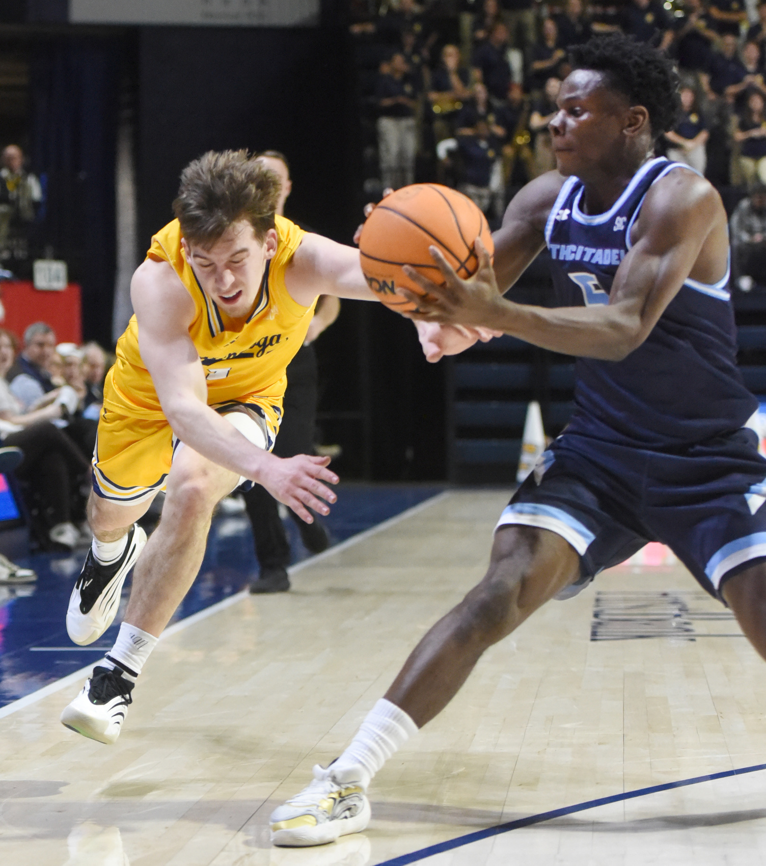 Staff photo by Matt Hamilton/ Citadel (5) Eze Wali steals the ball from UTC (1) Brennan Watkins during their game at McKenzie Arena on Saturday, Feb. 7, 2026.