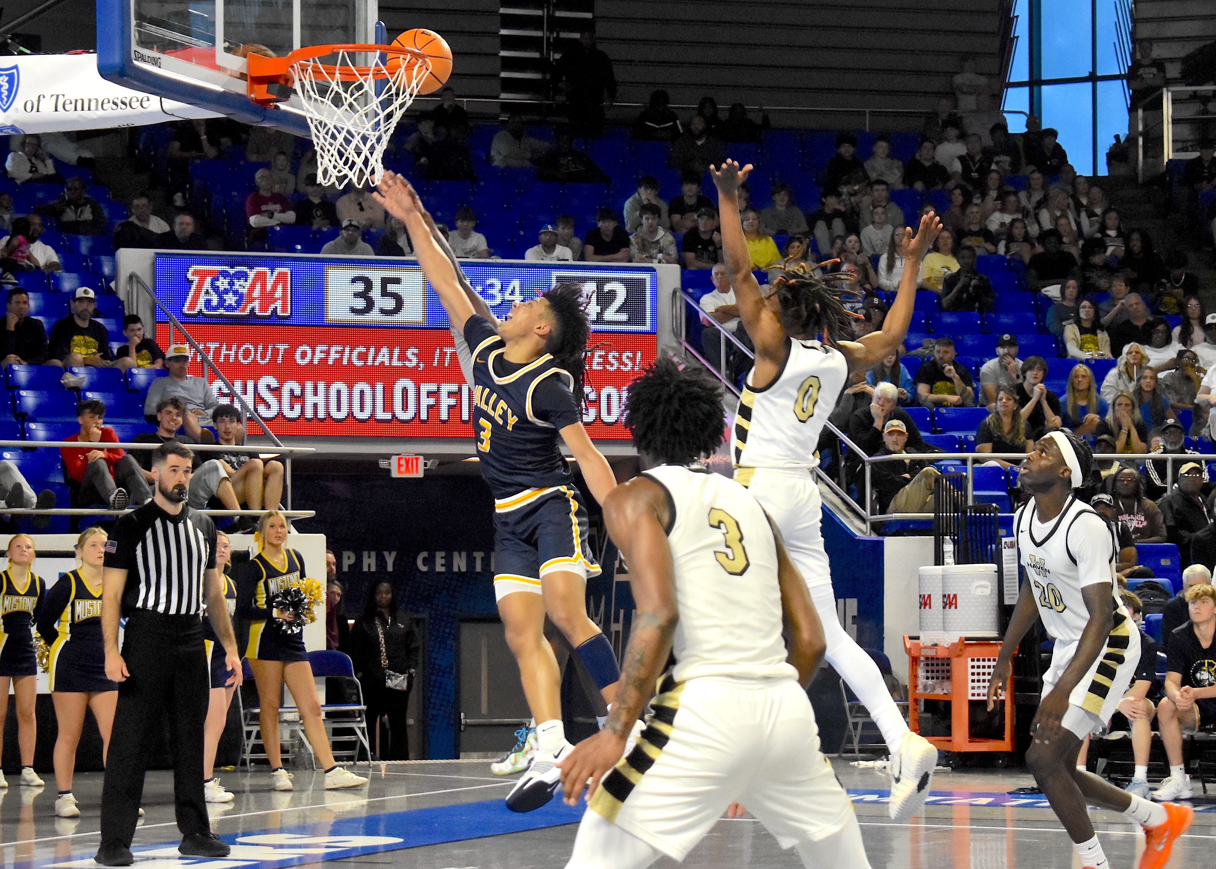 Staff photo by Patrick MacCoon / Walker Valley junior Zach Davis makes a tough layup through a foul despite being fouled by Whitehaven during a TSSAA Class 4A state semifinal Friday at Middle Tennessee State University's Murphy Center.