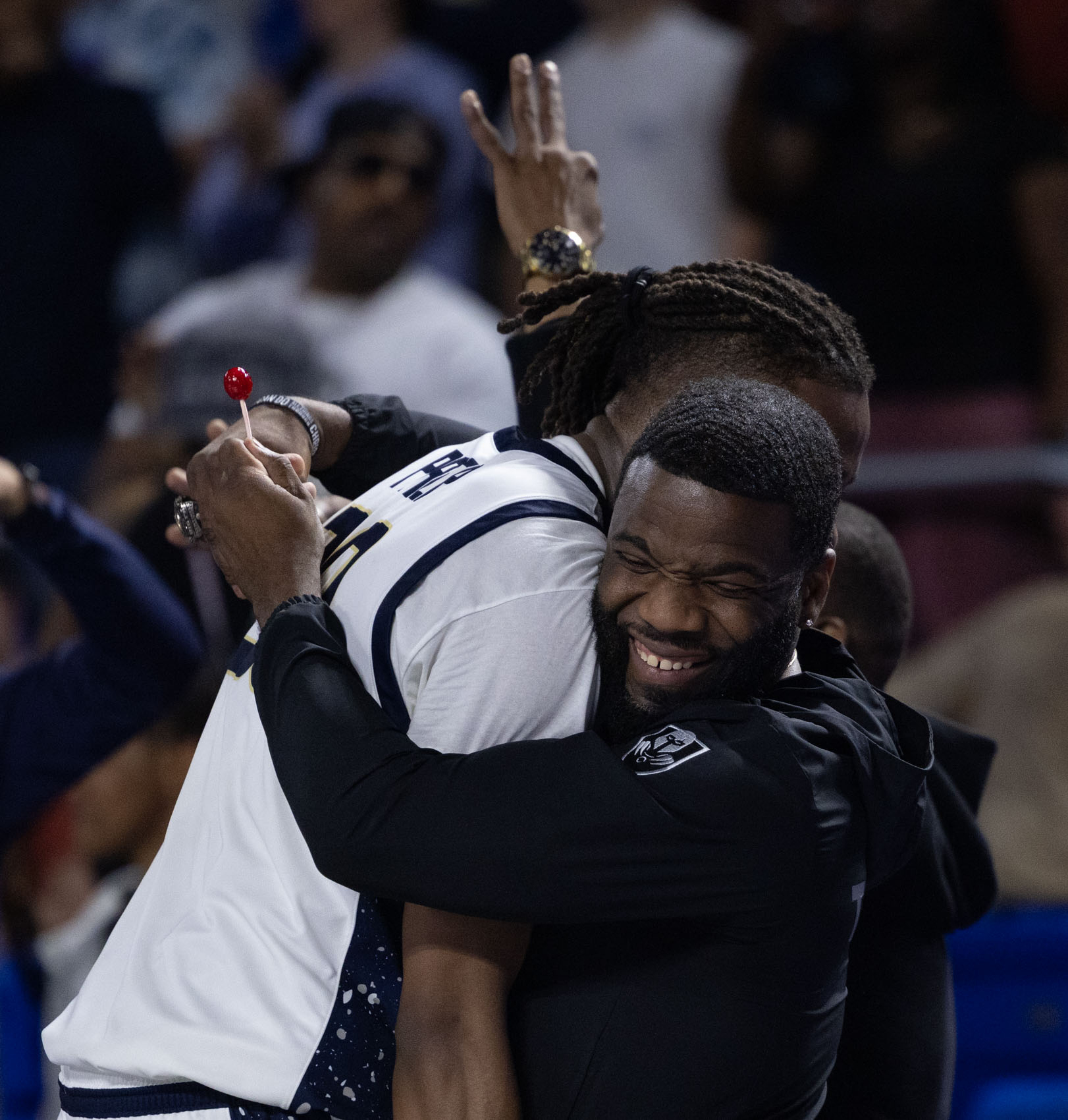 Staff photo by Larry Sullivan II/Chatt. Prep boys basketball Head Coach Christian Collins (right) hugs Derrick Roberson during the Class 2A basketball state championship game on Saturday, March 21, 2026.