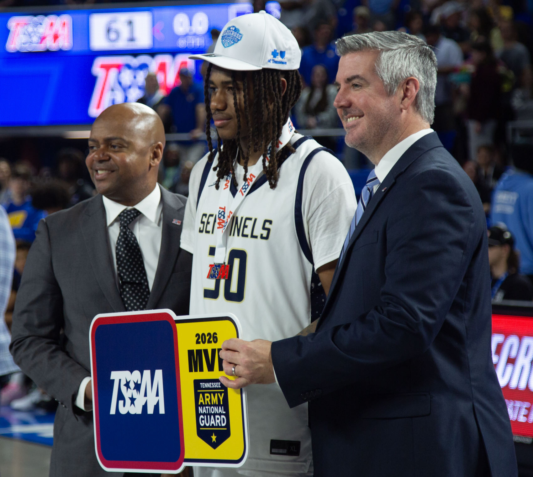 Staff photo by Larry Sullivan II/Chatt. Prep's Derrick Roberson (middle) poses for a photo after winning the MVP award after winning the Class 2A basketball state championship game on Saturday, March 21, 2026.