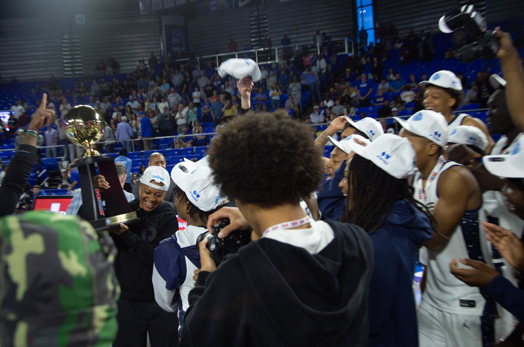 Staff photo by Larry Sullivan II/Chatt. Prep's Leigha Conley (with trophy) holds the state championship trophy after winning the Class 2A basketball state championship game on Saturday, March 21, 2026.