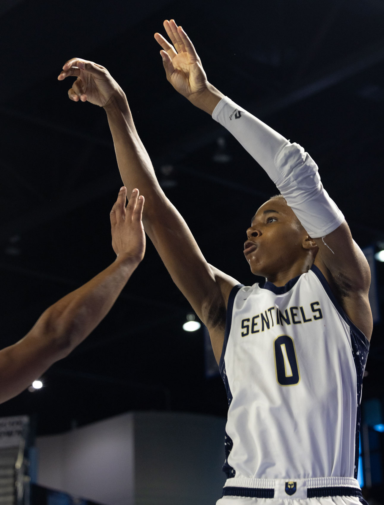 Staff photo by Larry Sullivan II/Chatt. Prep's Reid Conley shoots the basketball with a defenders hand in his face during the Class 2A basketball state championship game on Saturday, March 21, 2026.