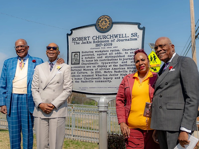 Martin B. Cherry / Nashville Banner / The late-Robert Churchwell's children, from left, Andre Churchwell, Keith Churchwell, Marisa Churchwell Smith and Robert Churchwell Jr., pose with the marker that honors his work and legacy.