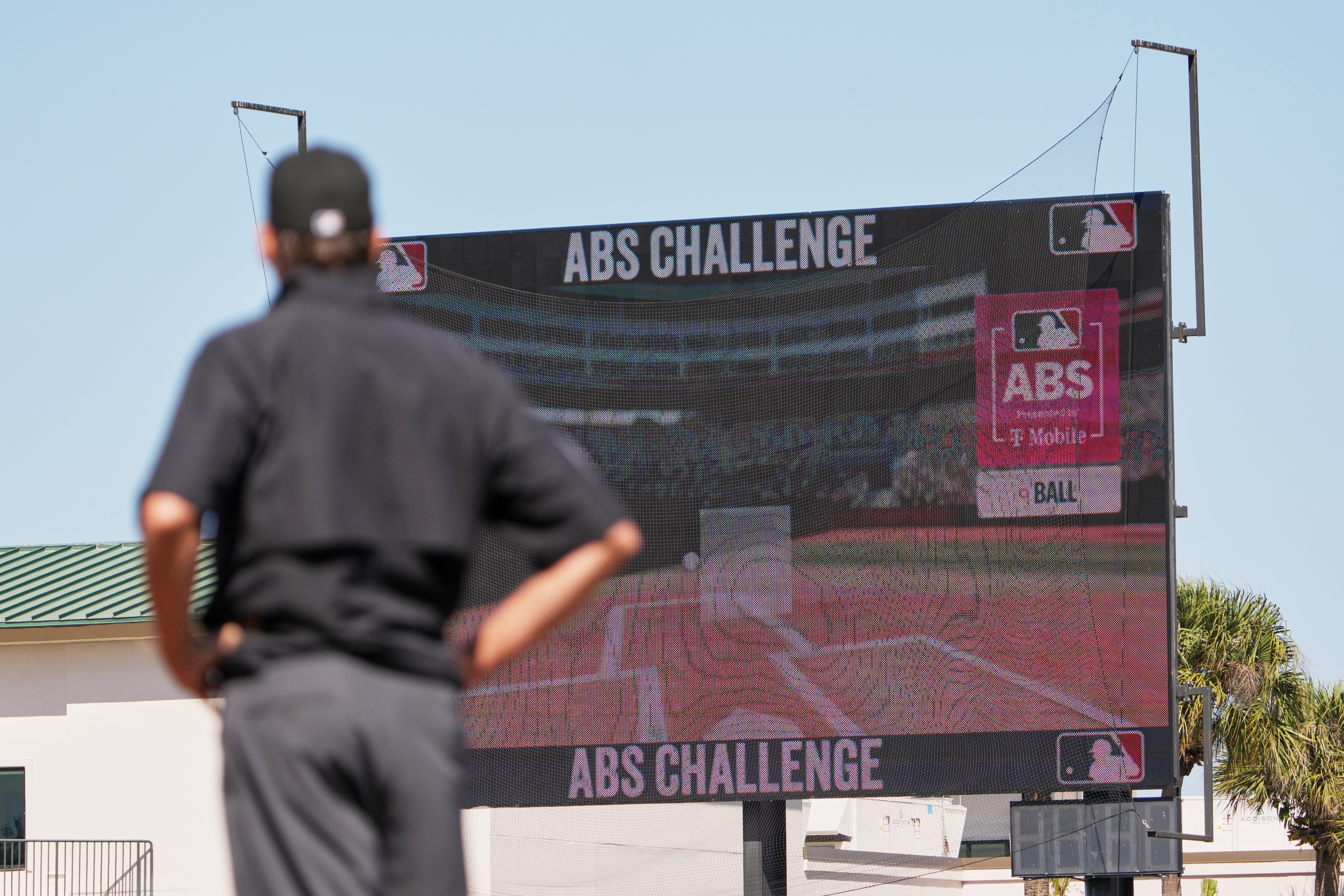 Umpire Ryan Additon watches as a call is challenged using MLB's ABS challenge system during the third inning of a spring training baseball game between the Miami Marlins and the Houston Astros Wednesday, Feb. 25, 2026, in Jupiter, Fla. (AP Photo/Jeff Roberson)