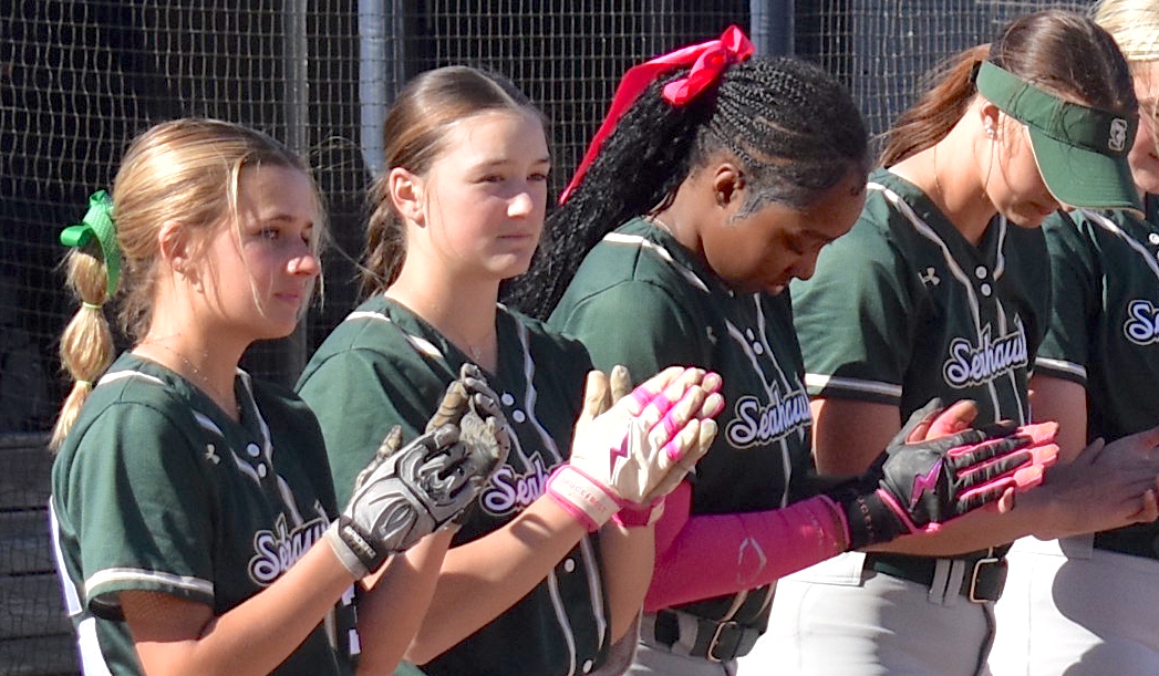 Staff photo by Patrick MacCoon / Silverdale Baptist softball players line up on the field for the playing of the national anthem prior to Monday's non-region road game against defending Division II-AA state champion Chattanooga Christian. The Lady Seahawks won the game 12-2 in five-innings to improve to 14-2-1 overall on the season.