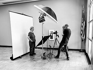 Aaron Patton, right, photographs a participant on Sept. 20, 2025, in ...