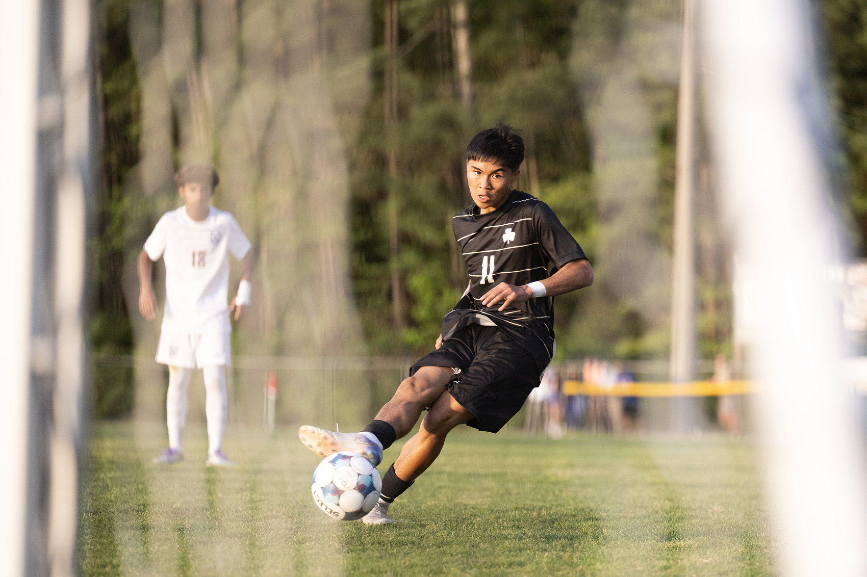 Staff Photo by Seth Carpenter/ Notre Dame's Caleb Salenda (11) scores one of his two goals against soccer rival Boyd Buchanan Friday at Notre Dame.