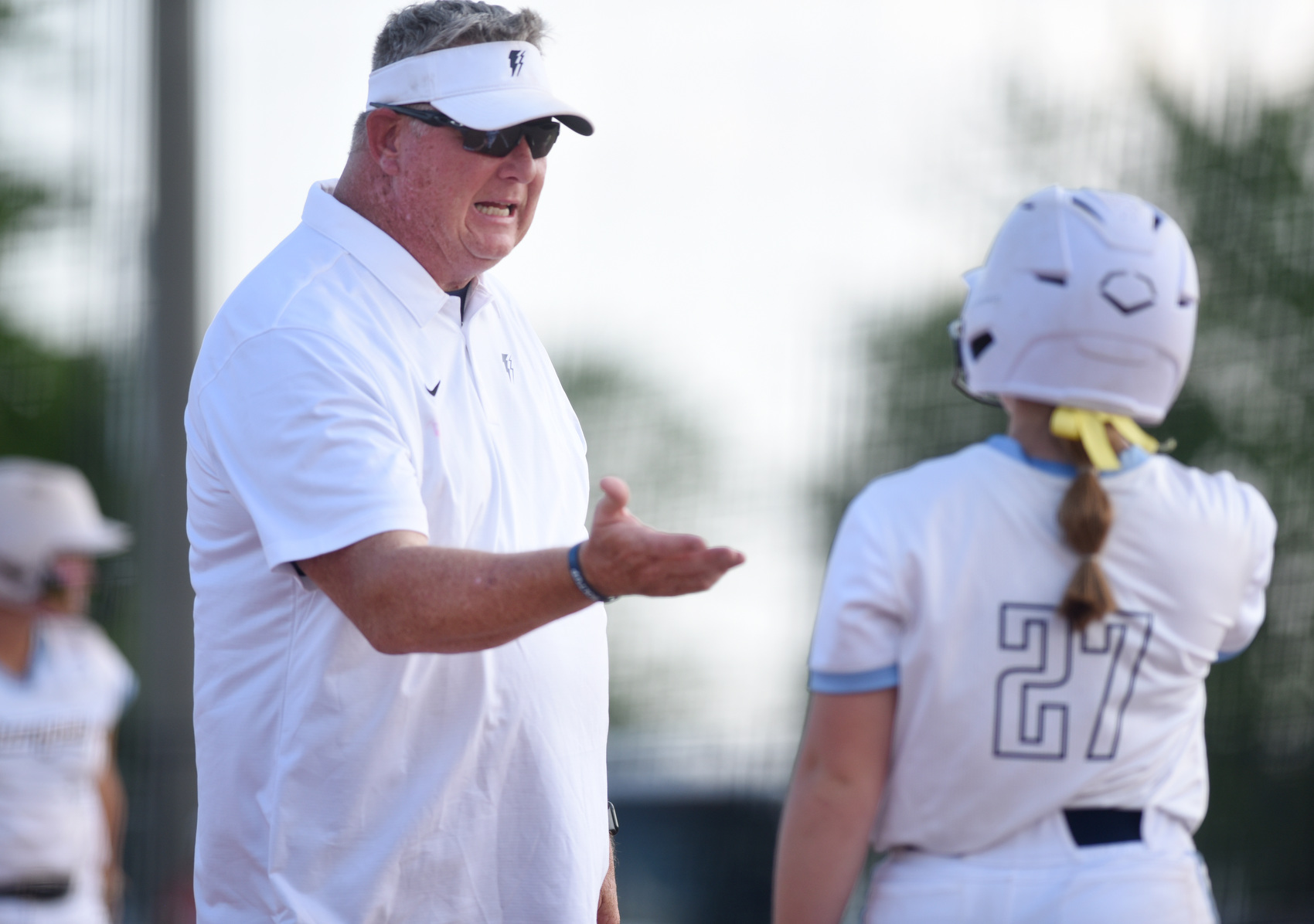 Staff photo by Matt Hamilton/ CCS head coach Stephen Rogers talks with (27) Kenzie Knox before she steps up to the plate during their softball match against Baylor on the first day of the Spring Fling in Murfreesboro on Tuesday, May 19, 2026.