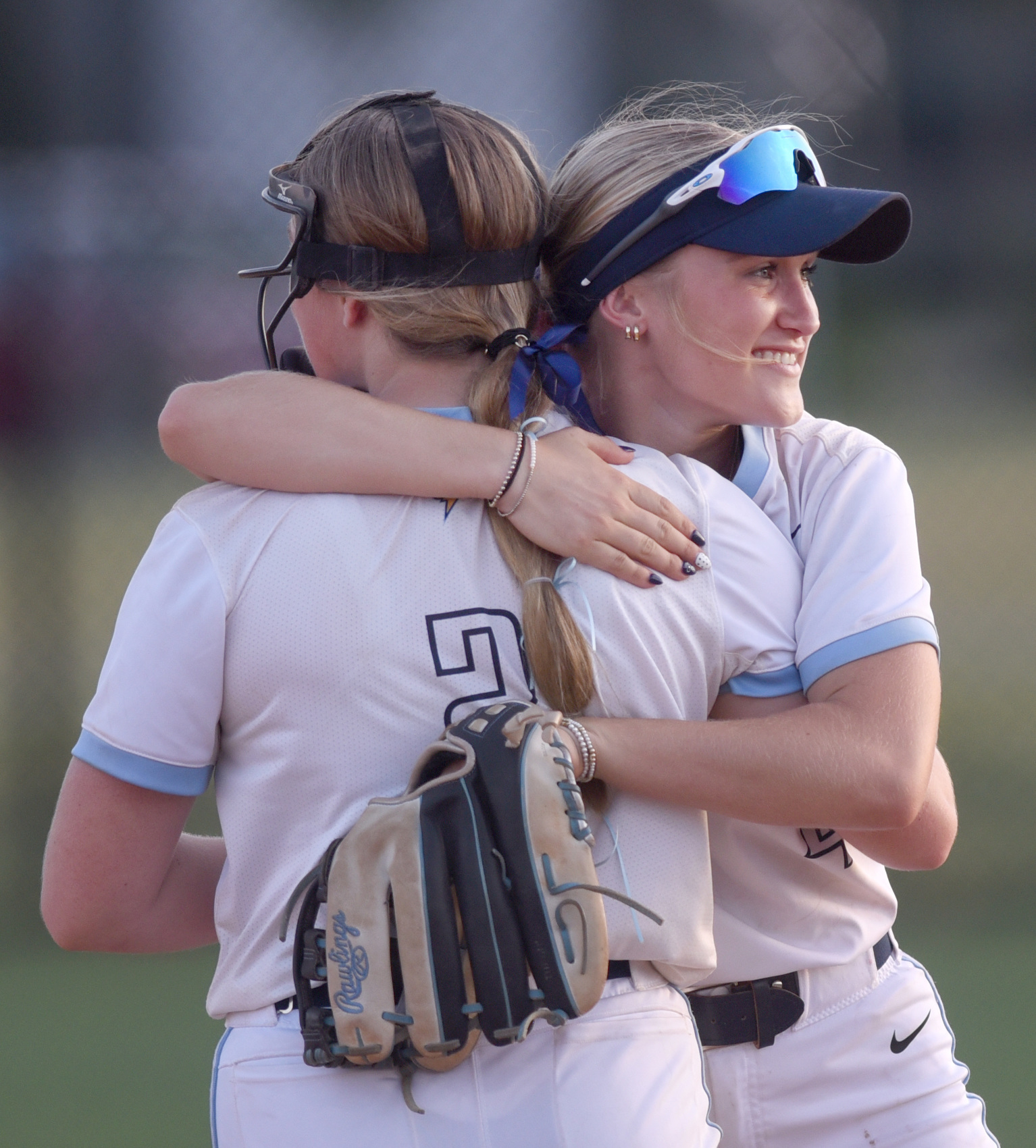 Staff photo by Matt Hamilton/ Chattanooga Christian softball teammates Neely Fillman, left, and Abby Fillman celebrate after Neely Fillman extended and made a catch during the Lady Chargers' win over Baylor Tuesday in Murfreesboro.