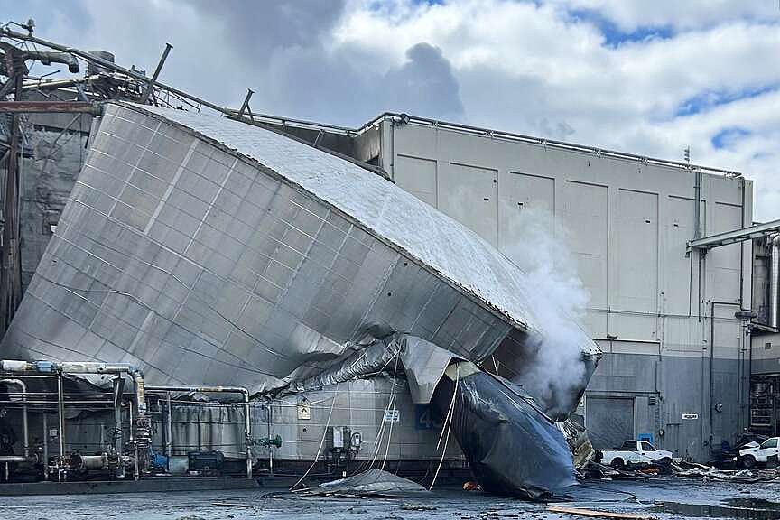 At least 1 dead, 9 others missing in chemical tank implosion at