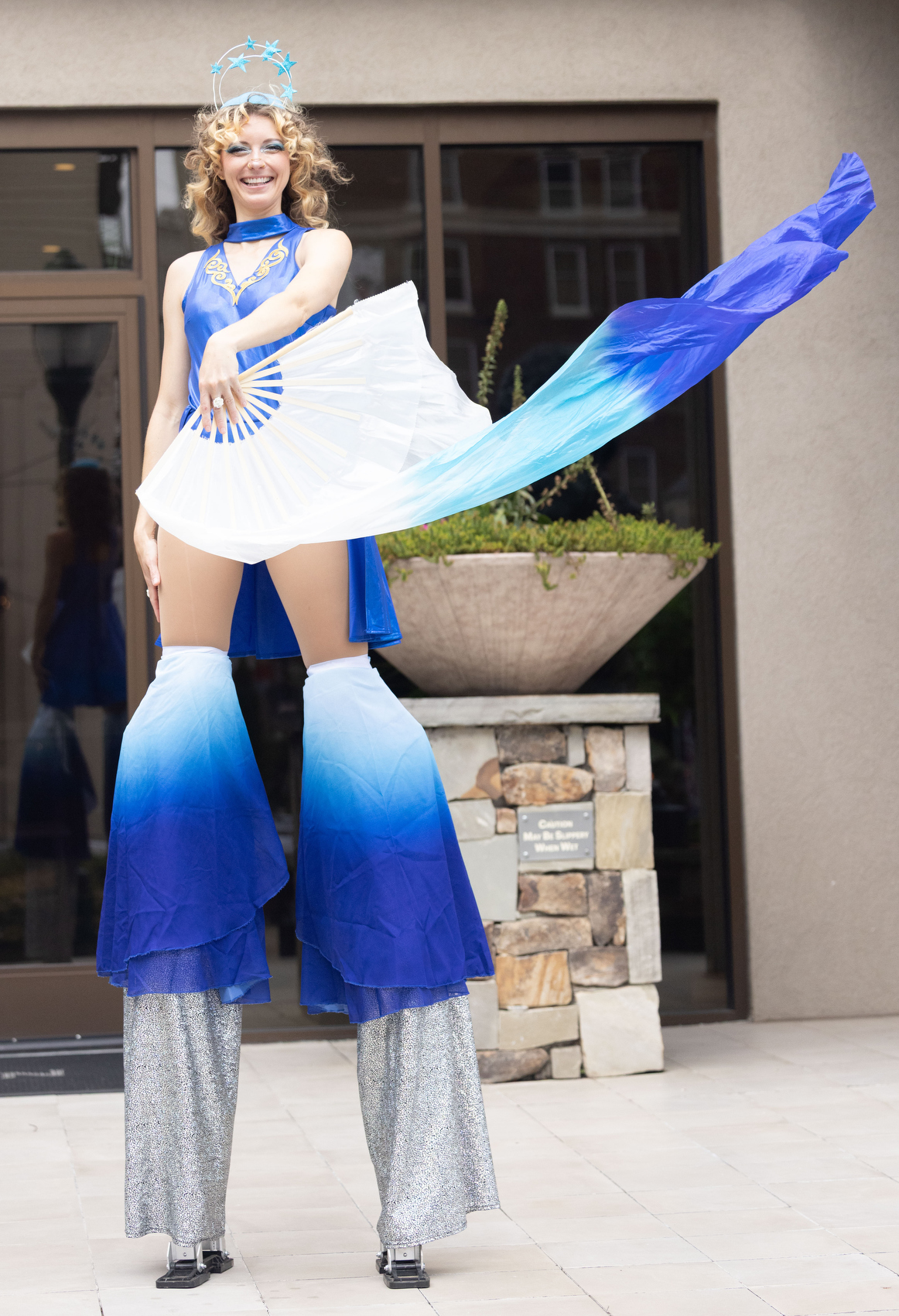 Staff photo by Larry Sullivan II / Crystalline Entertainment owner Chrystal Parker stands on stilts before the River City Co.'s 40th anniversary celebration at the Westin hotel.