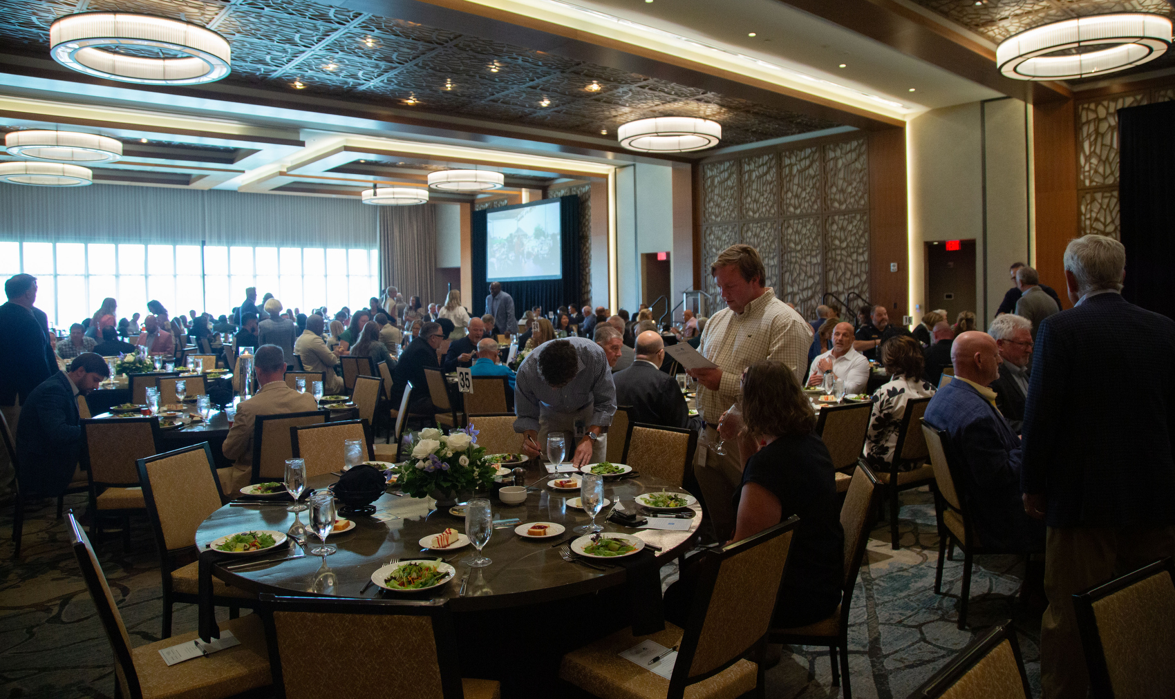Staff photo by Larry Sullivan II / Attendees of the River City Co.'s 40th anniversary celebration sit and eat at the Westin hotel.