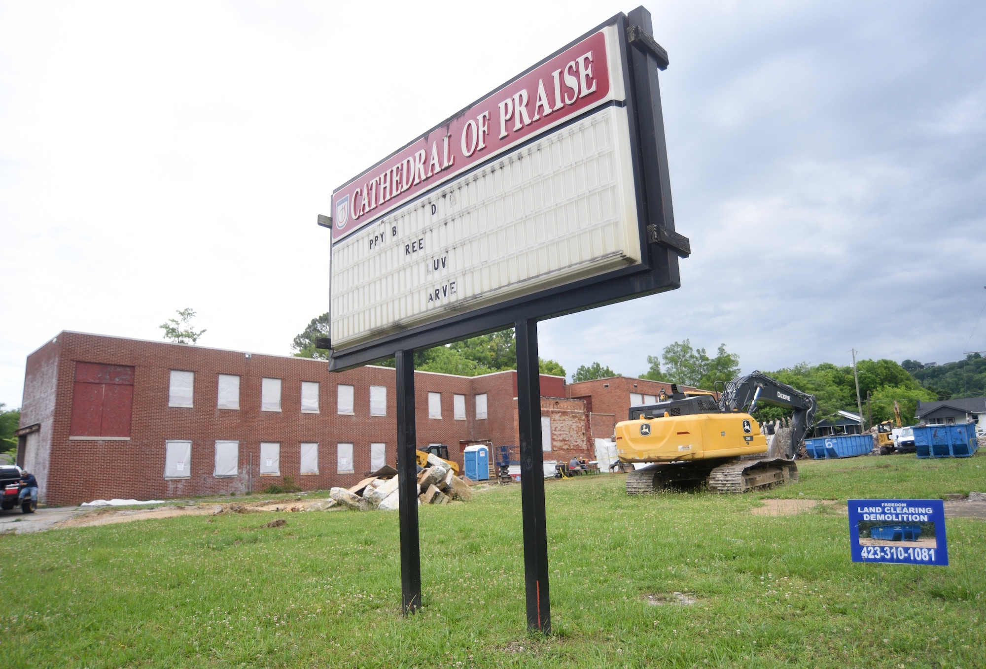 Staff file photo by Matt Hamilton / Workers tear down the Cathedral of Praise.