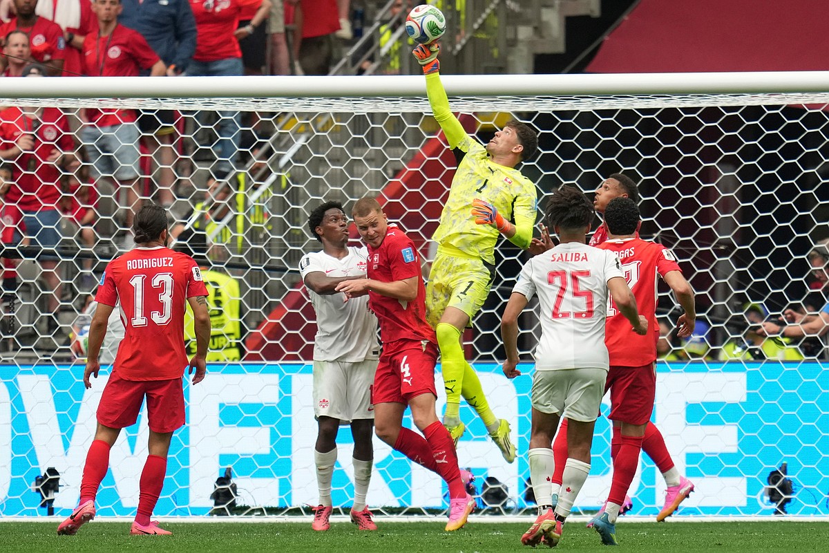 Switzerland tops Canada to win group, but both teams advance