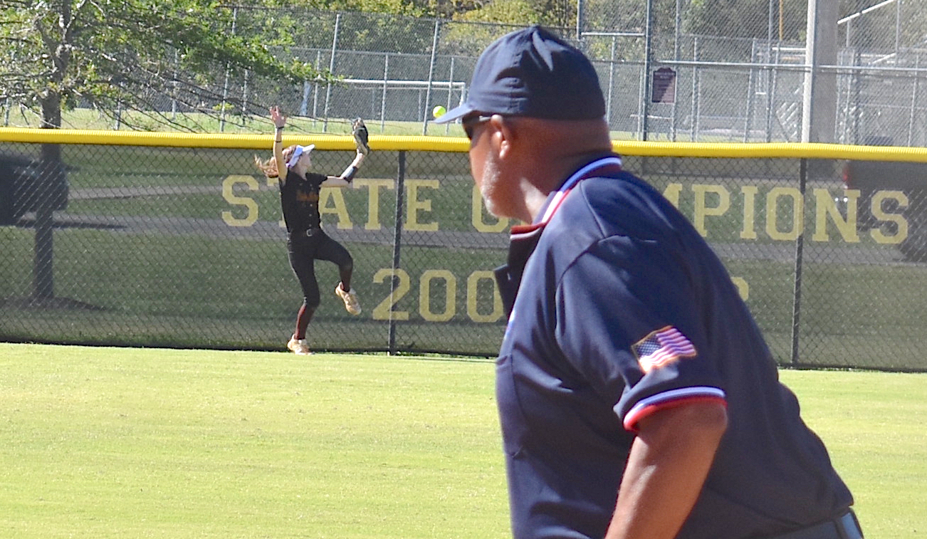 Staff photo by Patrick MacCoon / Dade County center fielder Riley Talley tries to make a leaping catch at the fence during Tuesday's home game against Metter in the second round of the GHSA Class AA state playoffs.