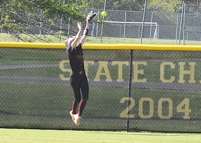 Staff photo by Patrick MacCoon / Dade County center fielder Riley Talley tries to make a leaping catch at the fence during Tuesday's home game against Metter in the second round of the GHSA Class AA state playoffs.
