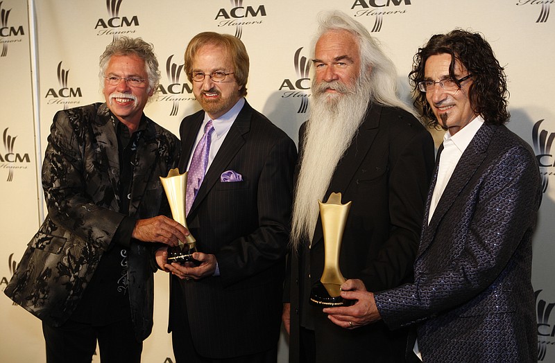 FILE - In this Sept. 17, 2008 file photo, The Oak Ridge Boys holds their Pioneer Award at the Academy of Country Music Honors awards  in Nashville, Tenn. (AP Photo/John Russell, file)