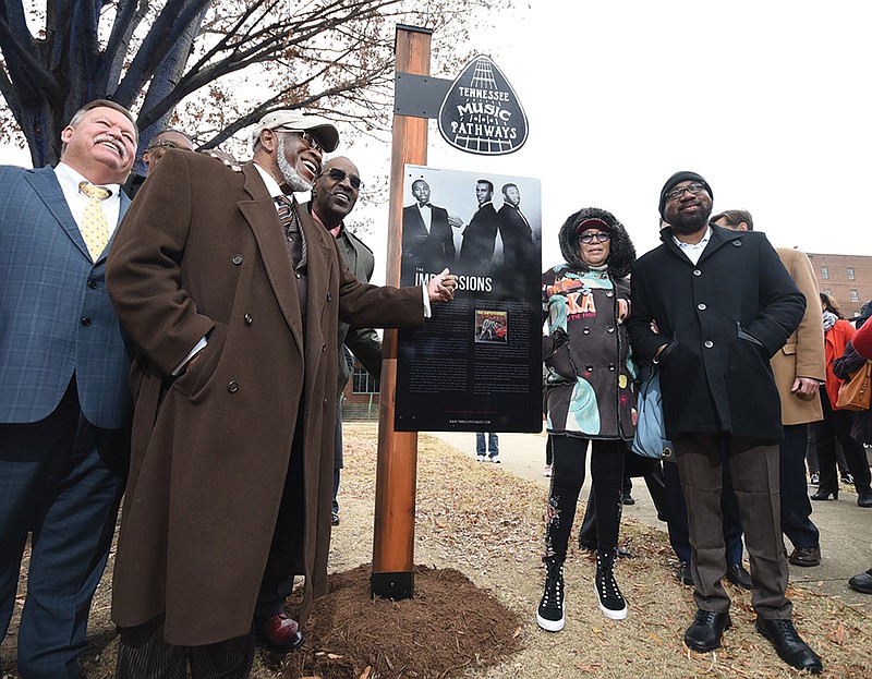 Staff photo by Tim Barber/ Hamilton County Mayor Jim Coppinger, far left, stands in with Fred Cash and Sam Gooden, of Impressions, who stand with Altheida Mayfield, Cheaa Mayfield at the unveiling of the Impressions sign out in front of the Bessie Smith Cultural Center for the dedication on Tuesday, Dec. 3, 2019.
