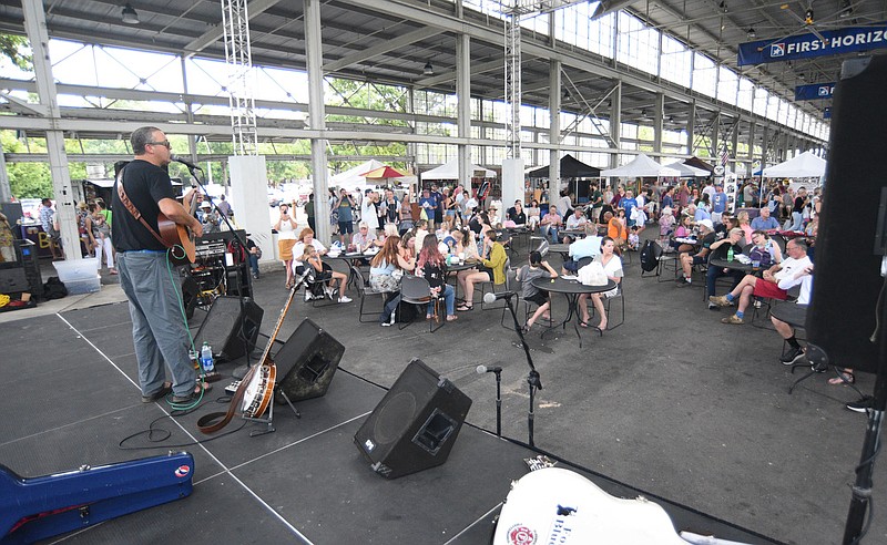 Staff photo by Matt Hamilton /  Chattanooga singer/songwriter Randy Steele performs on Sunday July 31, 2022 at the First Horizon Pavilion. The Chattanooga Market hosted Chattanooga Bluegrass at the market on Sunday, with performances by Randy Steele and New Grass Express.