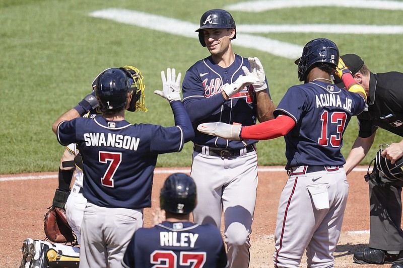 Atlanta Braves shortstop Dansby Swanson, left, and teammate Matt