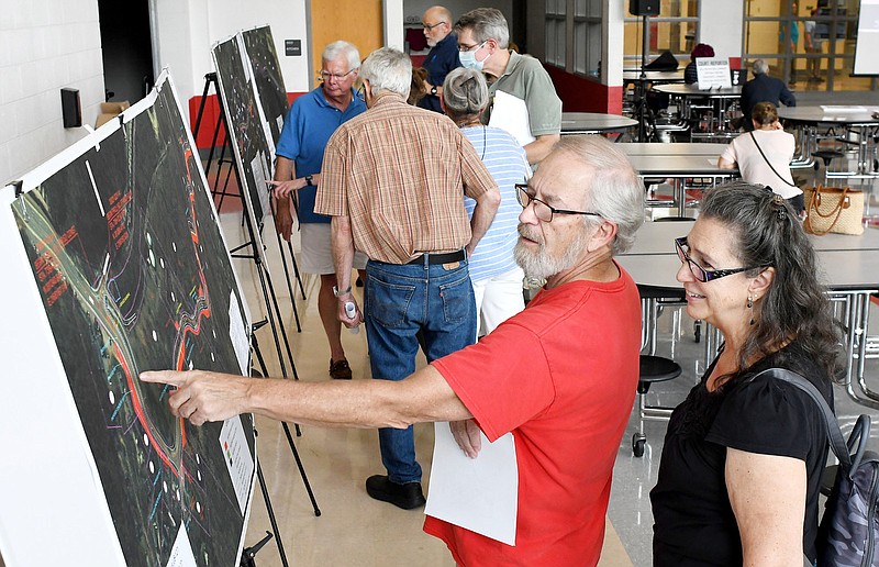 Staff Photo by Robin Rudd / Tom and Maribeth Powers examine maps of the proposed project.  The Tennessee Department of Transportation held a public meeting, concerning proposed SR-8 improvements, at Signal Mountain Middle/High School on August 25, 2022.