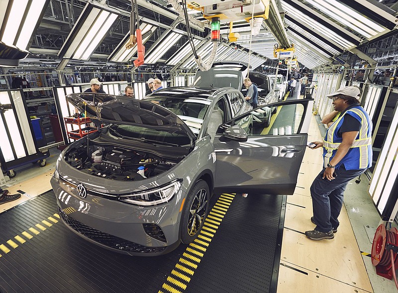 Contributed photo by Volkswagen / Volkswagen Chattanooga employees work on an ID.4 as production has begun on the electric SUV at the plant.