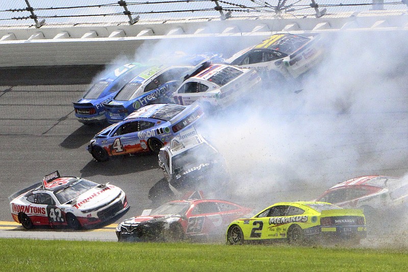 AP photo by Dow Graham / Chris Buescher (17), Daniel Suarez (99), Denny Hamlin (11), Justin Haley (31), Kevin Harvick (4), Ty Dillon (42), Aric Almirola (10) and others are involved in a crash between the first two turns at Daytona International Speedway during Sunday’s NASCAR Cup Series regular-season finale.