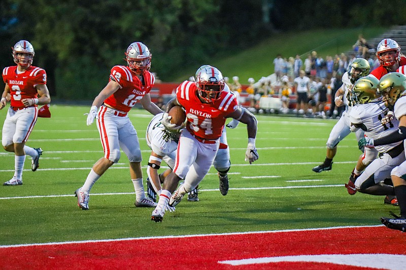 Staff photo by Olivia Ross  / Caleb Hampton scores a touchdown for Baylor during Friday night's home win against Knoxville Catholic to open Division II-AAA East/Middle Region competition.