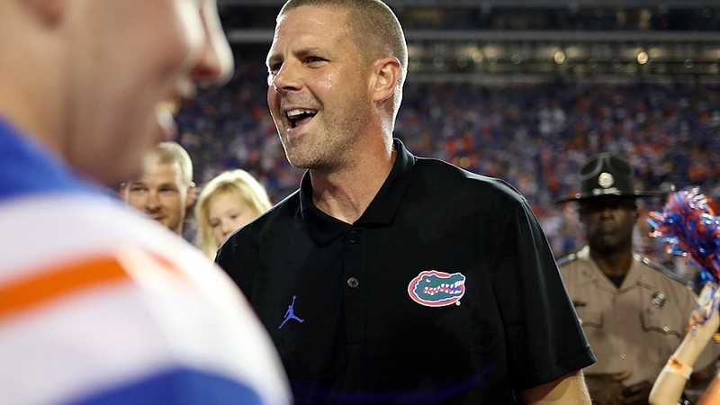 Florida Athletics photo by Courtney Culbreath / Florida first-year football coach Billy Napier receives congratulations after Saturday night’s 29-26 topping of No. 7 Utah inside the Swamp.