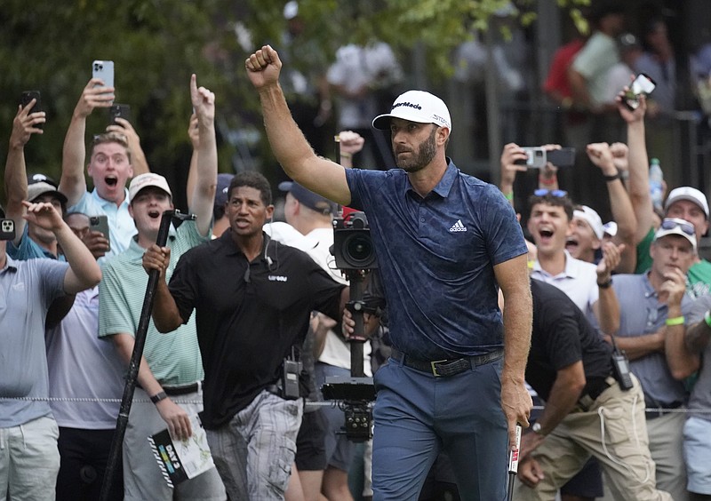 AP photo by Marcy Schwalm / Dustin Johnson celebrates after making an eagle putt to win the LIV Golf Invitational-Boston on the first hole of a sudden-death playoff Sunday in Bolton, Mass.