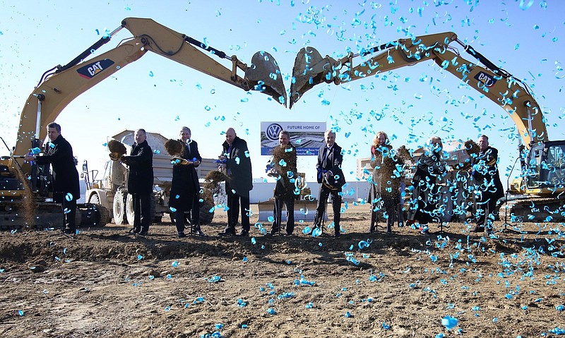 Staff File Photo / Local, state and Volkswagen officials toss dirt at the groundbreaking event for the Volkswagen electric vehicle facility at the VW plant on Nov. 13, 2019.