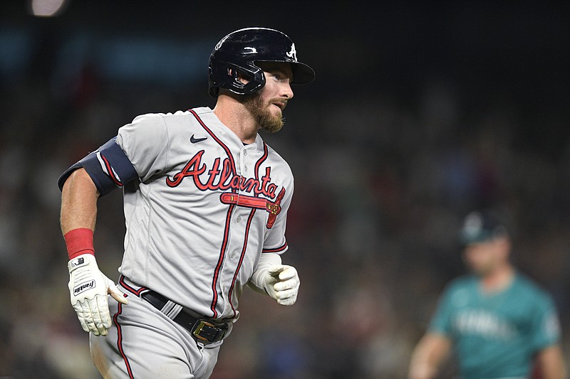 AP photo by Caean Couto / Atlanta Braves right fielder Robbie Grossman runs the bases after hitting a home run during Friday night’s game against the host Seattle Mariners.
