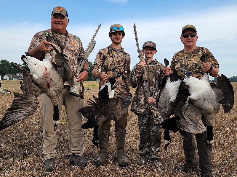 Photo contributed by Larry Case / Hunters pose with Canada geese during an early season hunt in northern Ohio. The Canada goose population increase has been a problem around the shores of Lake Erie since the 1960s, and hunting is used to help reduce the number of these birds, which can cause environmental, agricultural and property damage.