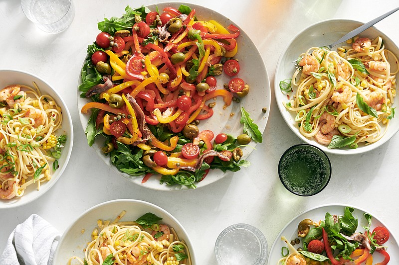 Marinated sweet peppers make a wonderfully zesty salad as a first course, and a shrimp-corn pasta topped with basil is an ideal follow-up. / David Malosh/The New York Times