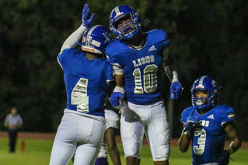 Staff photo by Olivia Ross / Red Bank's Tyler Wright (4) and AD Crutcher (10) celebrate during Friday night's home win against Region 3-4A opponent Central.