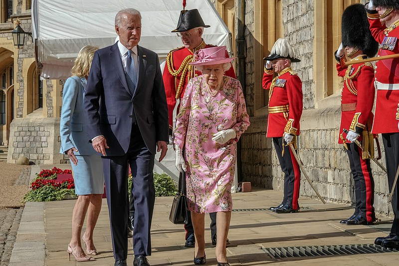 Andrew Testa/The New York Times / President Joe Biden with Queen Elizabeth II walk together at Windsor Castle in Windsor, England, on June 13, 2021.