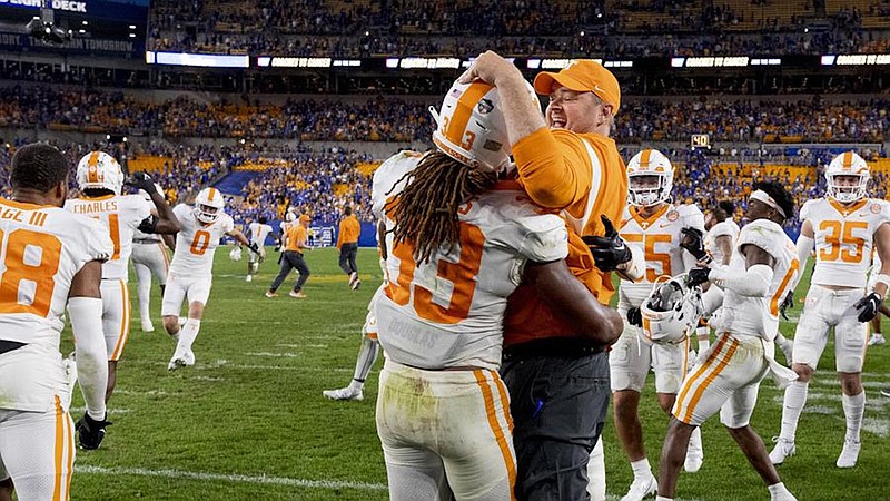 Tennessee Athletics photo by Andrew Ferguson / Tennessee second-year football coach Josh Heupel, shown  celebrating last Saturday’s 34-27 overtime win at Pittsburgh with linebacker Jeremy Banks, recently received a pay bump from $4 million to $5 million annually.