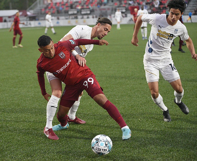 Staff file photo by Matt Hamilton / Moe Espinoza, front, scored a goal to help the Chattanooga Red Wolves earn a point in the USL League One standings with a 2-2 home draw against the Richmond Kickers on Saturday night.